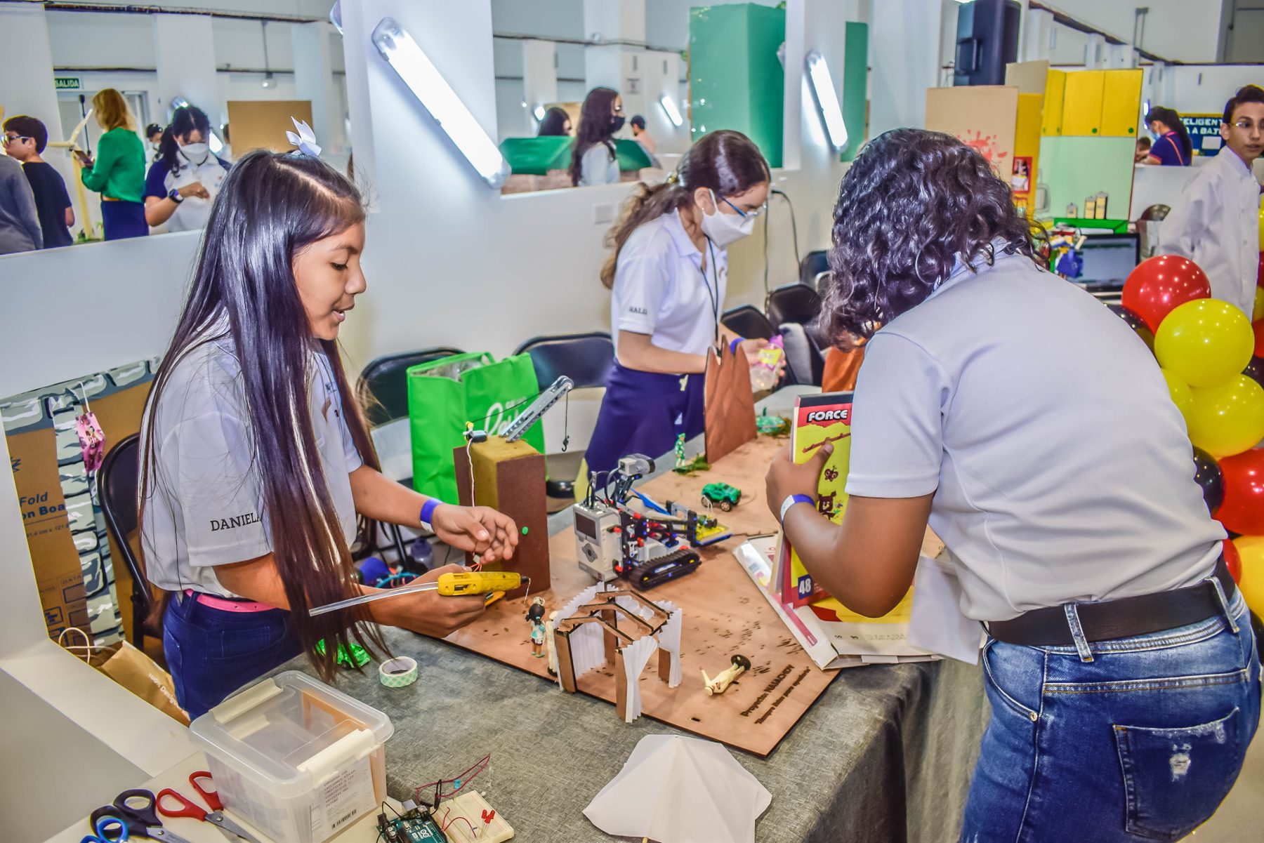 Students building their robot at the Olympiad
